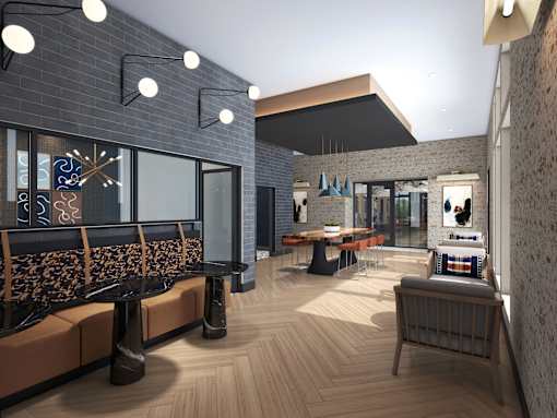A modern interior with wooden floors and a mix of seating options.