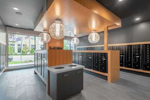A reception area with a counter and a row of lockers.