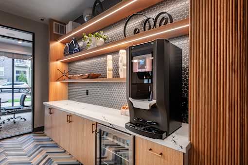 A modern kitchen with a countertop and a microwave.