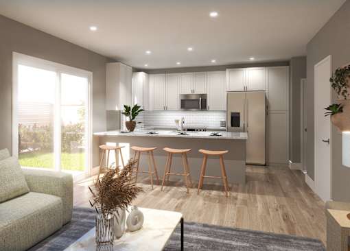 A modern kitchen with a bar area and a living room area.
