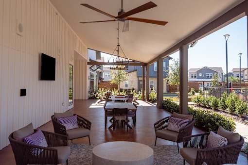 A patio with a table and chairs is shown.