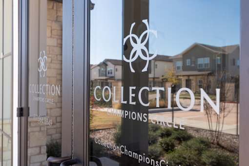 A glass door with the word "COLLECTION" written on it.