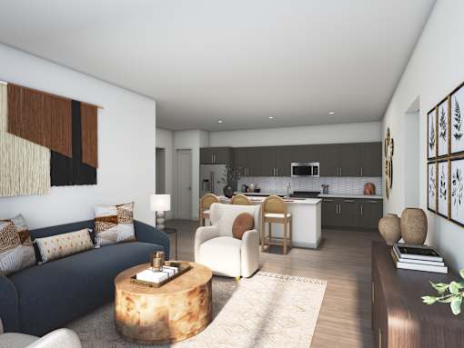A modern living room with a blue couch and a wooden coffee table.