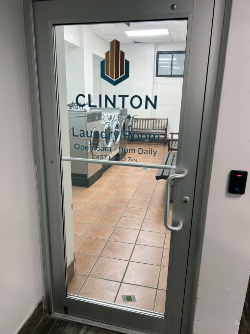 the door to the laundry room is open at Clinton Towers, New York