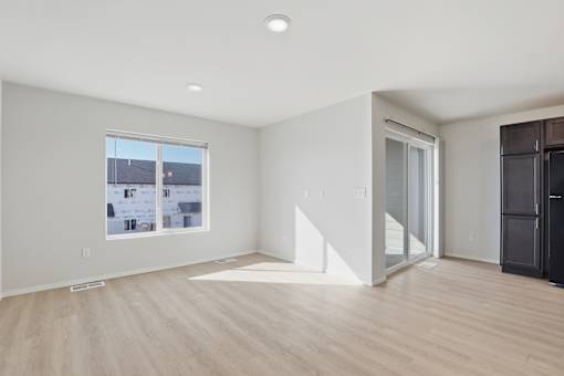 A room with a window and a door.