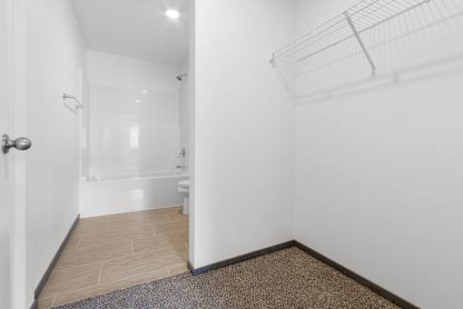 A bathroom with a toilet, sink, and shower.