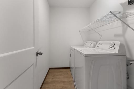 A laundry room with a washer and dryer.