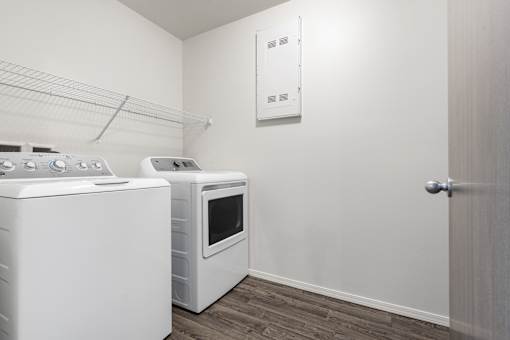 A white oven and microwave in a kitchen.