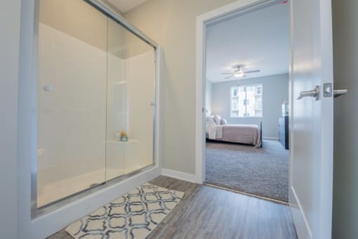 Modern bathroom featuring white oak vanity and walk-in shower