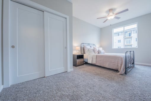 Modern bedroom featuring white oak accents and plenty of closet space