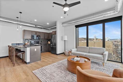 A modern kitchen with a dining table and chairs.