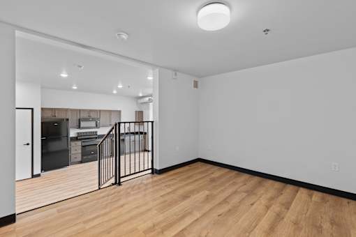 A room with wooden floors and white walls.