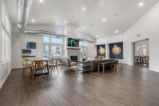 A modern living room with wooden floors and furniture.
