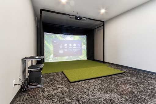 A projection room with a screen and a projector.
