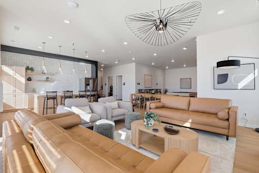A modern living room with a large sectional sofa and a coffee table.