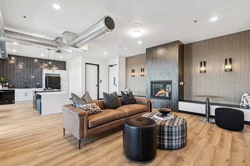 A modern living room with a fireplace and a couch.