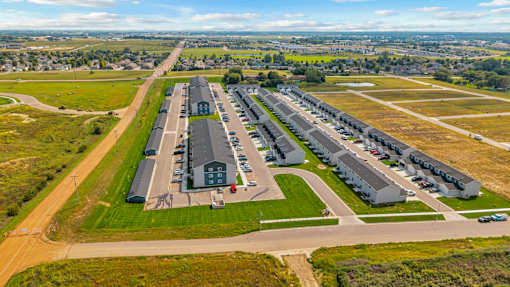 A large, well-maintained airport with multiple hangars and a runway.