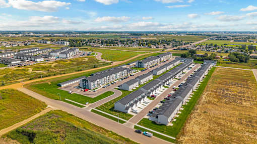 A large, well-maintained housing complex with multiple buildings and green spaces.