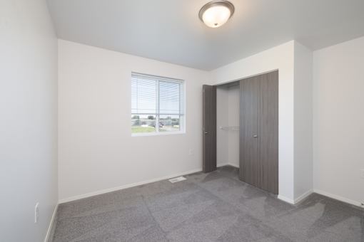 A room with a window and a door.