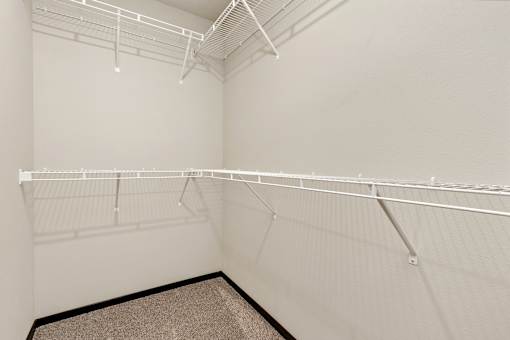 Empty white shelves in a room.