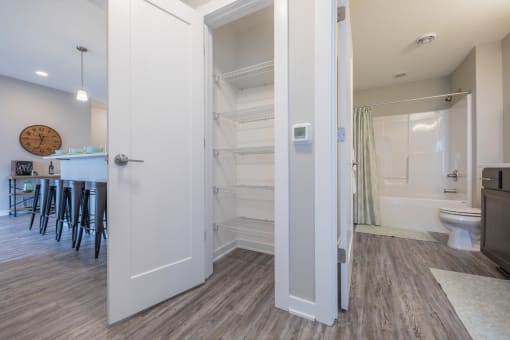 Clean and inviting bathroom with plenty of storage at White Oak