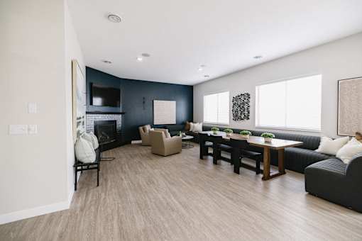 a living room with a couch and a table and a fireplace