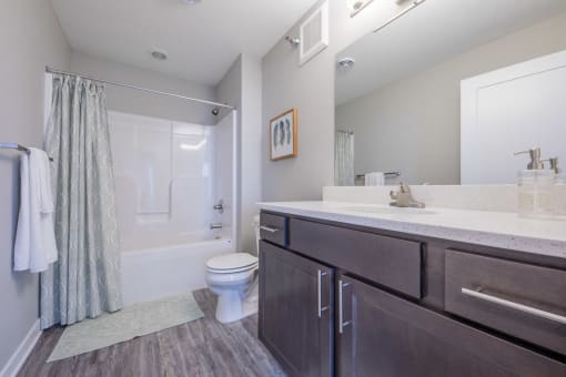 Clean and inviting bathroom with plenty of storage at White Oak