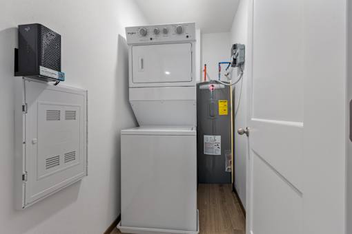 A small utility room with a washer and dryer.