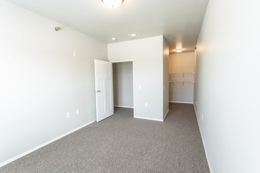 bedroom looking into closet and hallway