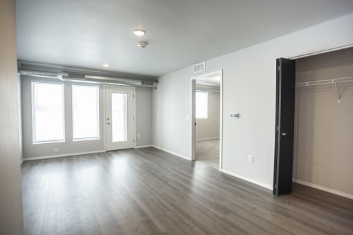 Spacious living room with neutral walls and ample natural light.