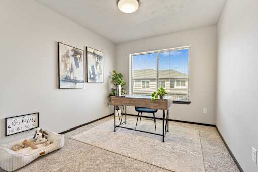 A room with a dog bed and a sign that says "dog kisses fix any mad dog".