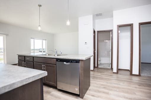 a kitchen with a sink and a counter top