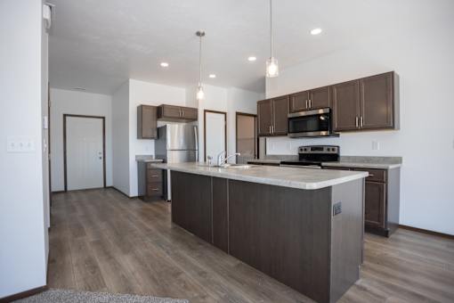 a kitchen with a large island in the middle