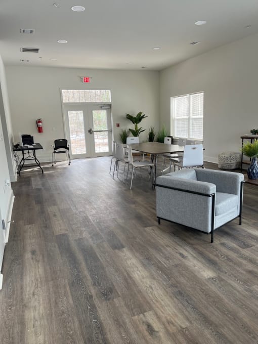 a living room with a table and chairs and a couch