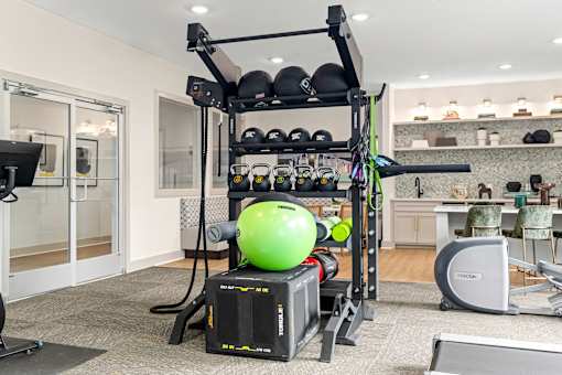 a home gym with a green ball in the middle at Radius on Grove, Austin, 78741