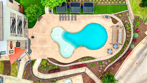 an aerial view of a swimming pool with a blue pool at Radius on Grove, Austin, TX, 78741