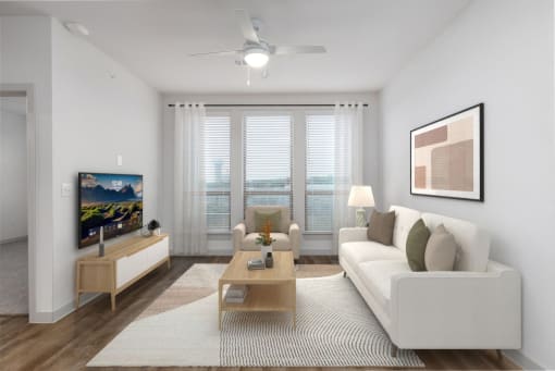 a living room with a white couch and a tv at Birdie on Woodland Greens, Austin
