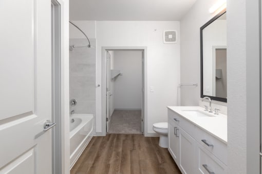 a renovated bathroom with a shower toilet and sink at Birdie on Woodland Greens, Texas