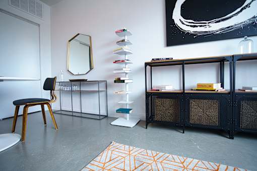 Contemporary living space with industrial storage furniture at THE'68 Apartments, Texas