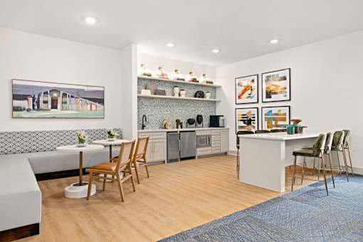 a living room with a kitchen and a dining table at Radius on Grove, Austin, TX