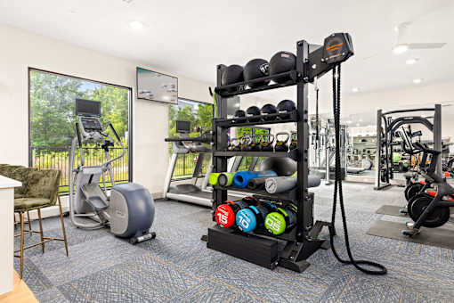 the preserve at ballantyne commons fitness room with weights and cardio equipment at Radius on Grove, Austin, TX
