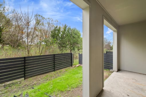 a black fence with a blue sky in the background at Radius on Grove, Texas