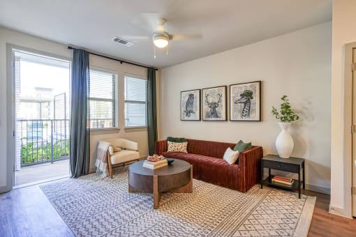 an open living room with a couch and a coffee table at Birdie on Woodland Greens, Austin, 78726