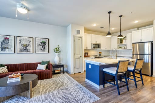 a living area with a kitchen and a dining table at Birdie on Woodland Greens, Austin, Texas