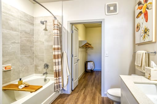 a bathroom with a shower and a toilet and a sink at Birdie on Woodland Greens, Austin, Texas