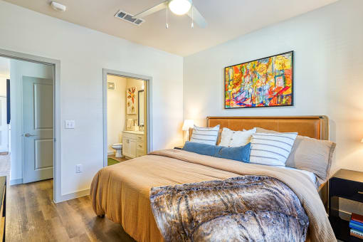 a bedroom with a bed and a bathroomat Birdie on Woodland Greens, Texas 78726