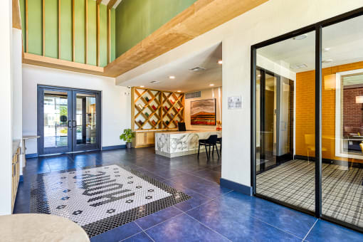 the lobby or reception area of a house with a large glass door at Birdie on Woodland Greens, Austin, 78726