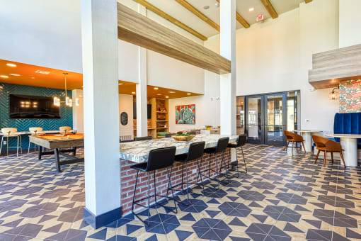 a restaurant with a blue and white tiled floor and tables with chairs at Birdie on Woodland Greens, Austin, 78726