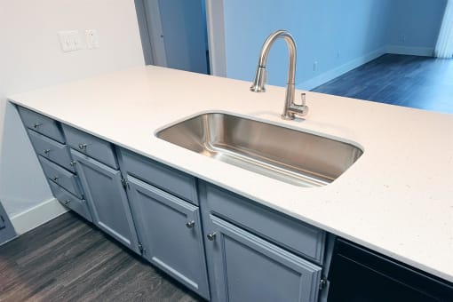 an empty kitchen counter with a sink and a faucet at Northchase, Austin, TX, 78753