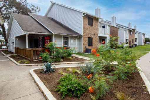 the front yard of a house with flowers and a sidewalk at Northchase,Texas
